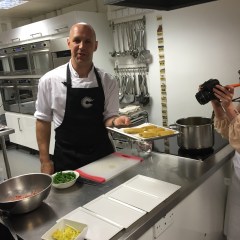 Adam shows off a tray of bread-wrapped mackerel